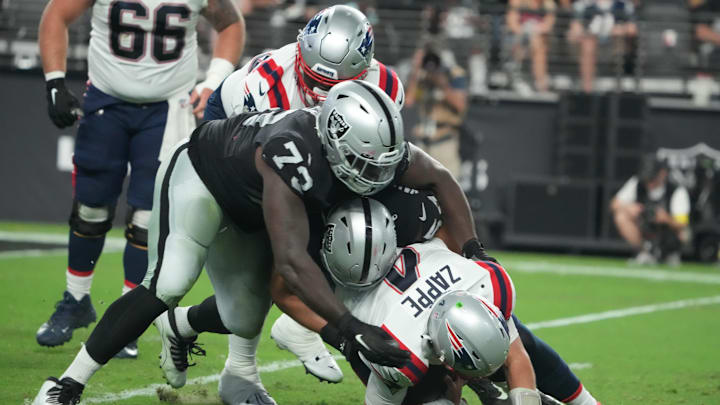 Aug 26, 2022; Paradise, Nevada, USA; Las Vegas Raiders defensive tackle Matthew Butler (73) and defensive end Zach VanValkenburg (54) sack New England Patriots quarterback Bailey Zappe (4) in the second half at Allegiant Stadium. Mandatory Credit: Kirby Lee-USA TODAY Sports