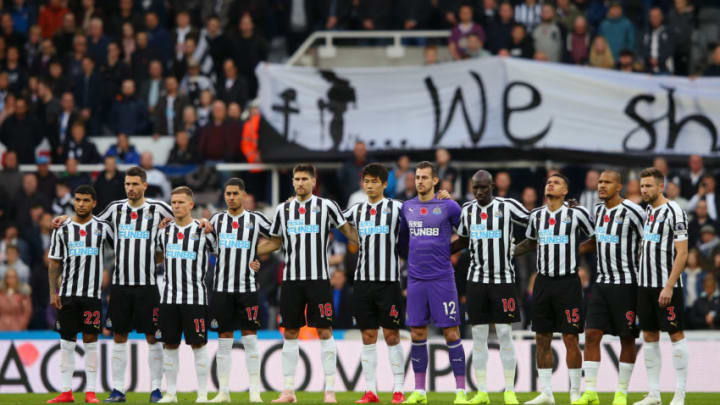 NEWCASTLE UPON TYNE, ENGLAND - NOVEMBER 10: Newcastle United players observe a minutes silence for Remembrance Day prior to the Premier League match between Newcastle United and AFC Bournemouth at St. James Park on November 10, 2018 in Newcastle upon Tyne, United Kingdom. (Photo by Alex Livesey/Getty Images)