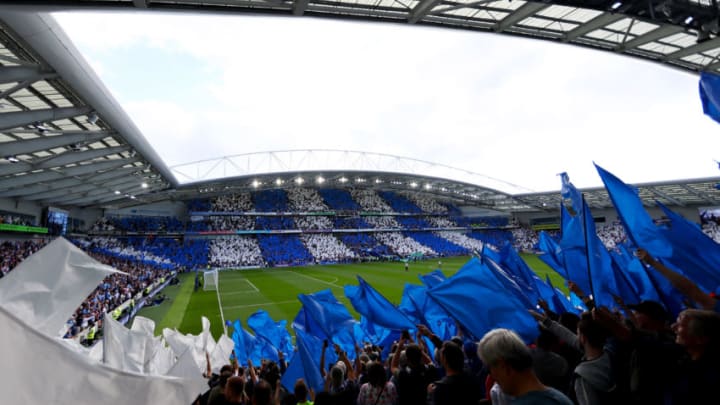 BRIGHTON, ENGLAND - AUGUST 12: Fans wave flags the teams enter the field before the Premier League match between Brighton and Hove Albion and Manchester City at Amex Stadium on August 12, 2017 in Brighton, England. (Photo by Dan Istitene/Getty Images)