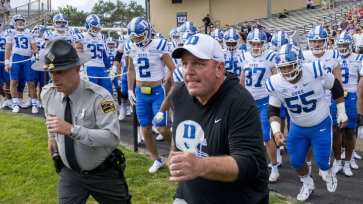 Sep 10, 2022; Evanston, Illinois, USA; Duke Blue Devils head coach Mike Elko leads his team out prior to the first quarter against the Northwestern Wildcats at Ryan Field. Mandatory Credit: Patrick Gorski-USA TODAY Sports