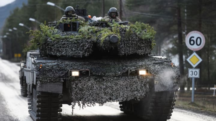 ELVAL, NORWAY - NOVEMBER 03: A Polish Army tank crew drive a Leopard II tank through the residential streets, during the live exercise on November 3, 2018 in Elval, Norway. Over 40,000 participants from 31 nations are taking part in the NATO "Trident Juncture" exercise to test inter-operability between forces, and is the largest exercise of its kind to be held in Norway since the 1980s. (Photo by Leon Neal/Getty Images)