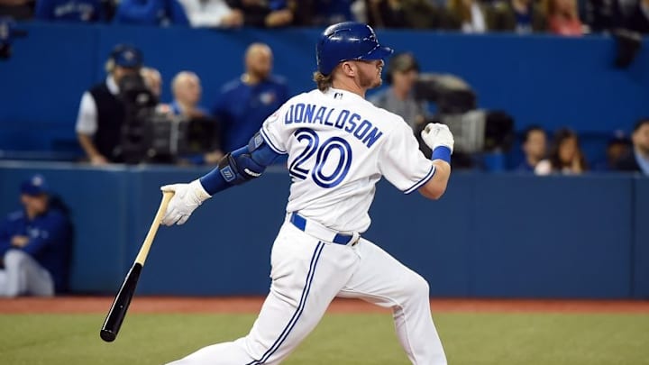 May 2, 2016; Toronto, Ontario, CAN; Toronto Blue Jays third baseman Josh Donaldson (20) hits a single against Texas Rangers in the eighth inning at Rogers Centre. Mandatory Credit: Dan Hamilton-USA TODAY Sports