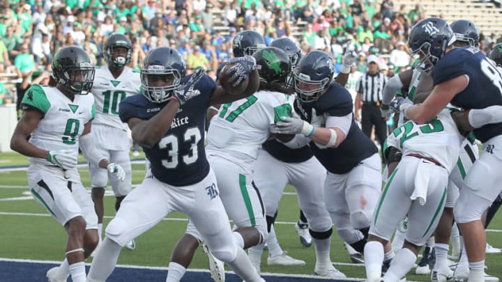 HOUSTON, TX - SEPTEMBER 24: Running back Emmanuel Esukpa #33 of the Rice Owls rushes for a touchdown against the North Texas Mean Green defense in the first half at Rice Stadium on September 24, 2016 in Houston, Texas. (Photo by Thomas B. Shea/Getty Images)