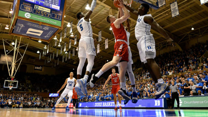 DURHAM, NC - DECEMBER 05: Zion Williamson #1 of the Duke Blue Devils defends a shot by John Carroll #5 of the Hartford Hawks in the second half at Cameron Indoor Stadium on December 5, 2018 in Durham, North Carolina. (Photo by Lance King/Getty Images)