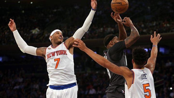 Nov 9, 2016; New York, NY, USA; Brooklyn Nets power forward Trevor Booker (35) has the ball stripped by New York Knicks small forward Carmelo Anthony (7) in front of New York Knicks shooting guard Courtney Lee (5) during the second quarter at Madison Square Garden. Mandatory Credit: Brad Penner-USA TODAY Sports