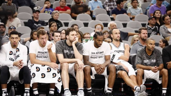Oct 14, 2016; San Antonio, TX, USA; San Antonio Spurs players (left to right) Danny Green (14), along with David Lee (10) and Pau Gasol (16) and Kawhi Leonard (2) and Manu Ginobili (20) and Tony Parker (9) watch on the bench during the second half against the Miami Heat at AT&T Center. Mandatory Credit: Soobum Im-USA TODAY Sports