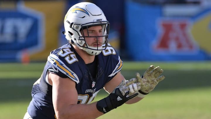 Nov 13, 2016; San Diego, CA, USA; San Diego Chargers defensive end Joey Bosa (99) raises his arms as he engages with a Miami Dolphins defender during the second quarter at Qualcomm Stadium. Mandatory Credit: Orlando Ramirez-USA TODAY Sports