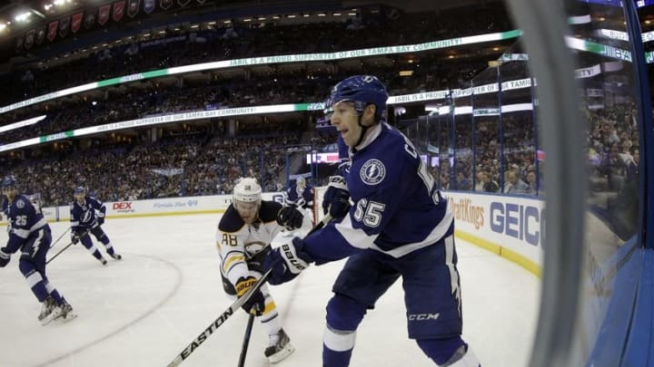 Nov 10, 2015; Tampa, FL, USA; Tampa Bay Lightning defenseman Braydon Coburn (55) shoots as Buffalo Sabres left wing Jamie McGinn (88) defends during the third period at Amalie Arena. Buffalo Sabres defeated the Tampa Bay Lightning 4-1. Mandatory Credit: Kim Klement-USA TODAY Sports