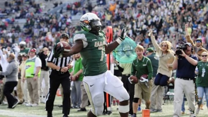 Nov 22, 2014; Birmingham, AL, USA; UAB Blazers running back Jordan Howard (7) runs the ball for a touchdown during the second half against the Marshall Thundering Herd at Legion Field. Marshall defeated UAB 23-18. Mandatory Credit: Shanna Lockwood-USA TODAY Sports