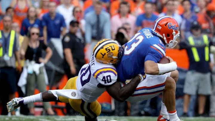 GAINESVILLE, FL - OCTOBER 07: Feleipe Franks #13 of the Florida Gators is sacked by Devin White #40 of the LSU Tigers during the game at Ben Hill Griffin Stadium on October 7, 2017 in Gainesville, Florida. (Photo by Sam Greenwood/Getty Images)