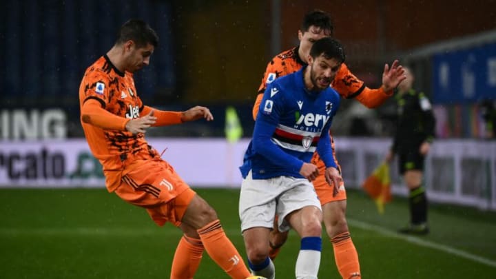 Juventus' Spanish forward Alvaro Morata (L) fights for the ball with Sampdoria's midfielder Bartosz Bereszynski from Poland (C) during the Italian Serie A football match Sampdoria vs Juventus played behind closed doors on January 30, 2021 at the Luigi Ferraris Stadium in Genoa. (Photo by MARCO BERTORELLO / AFP) (Photo by MARCO BERTORELLO/AFP via Getty Images)