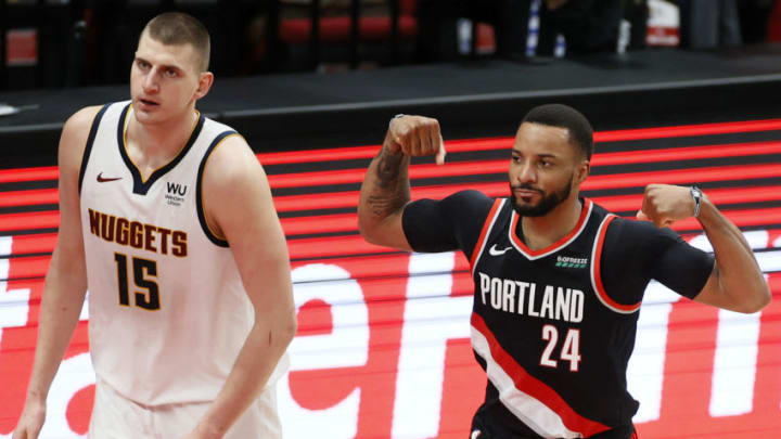 Norman Powell of the Portland Trail Blazers flexes after his basket against Nikola Jokic of the Denver Nuggets (Photo by Steph Chambers/Getty Images)