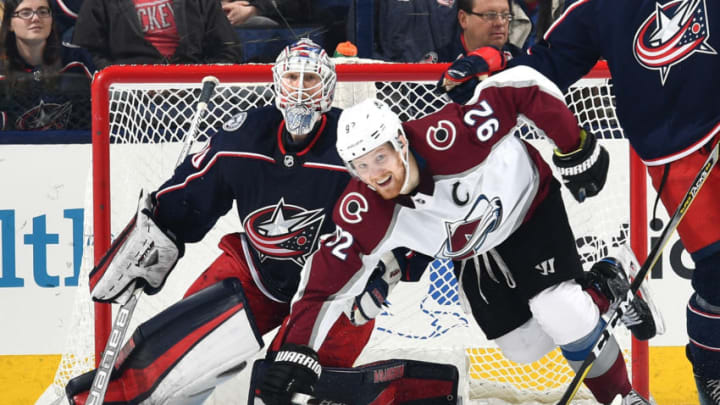 COLUMBUS, OH - MARCH 8: Goaltender Joonas Korpisalo #70 of the Columbus Blue Jackets defends the net as Gabriel Landeskog #92 of the Colorado Avalanche skates by on March 8, 2018 at Nationwide Arena in Columbus, Ohio. (Photo by Jamie Sabau/NHLI via Getty Images)