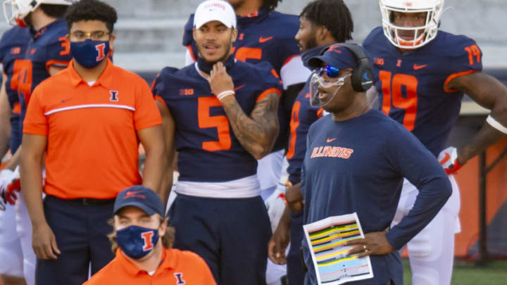 Nov 7, 2020; Champaign, Illinois, USA; Illinois Fighting Illini head coach Lovie Smith (R) looks on from the sideline during the first half against the Minnesota Golden Gophers at Memorial Stadium. Mandatory Credit: Patrick Gorski-USA TODAY Sports