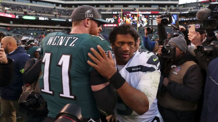 PHILADELPHIA, PA - NOVEMBER 24: Russell Wilson #3 of the Seattle Seahawks hugs Carson Wentz #11 of the Philadelphia Eagles after the game at Lincoln Financial Field on November 24, 2019 in Philadelphia, Pennsylvania. (Photo by Mitchell Leff/Getty Images)
