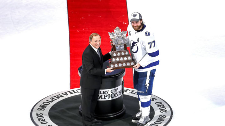 EDMONTON, ALBERTA - SEPTEMBER 28: NHL commissioner Gary Bettman presents Victor Hedman #77 of the Tampa Bay Lightning with the Conn Smythe Trophy for playoff MVP following the Lightning’s series-winning victory over the Dallas Stars in Game Six of the 2020 NHL Stanley Cup Final at Rogers Place on September 28, 2020 in Edmonton, Alberta, Canada. (Photo by Bruce Bennett/Getty Images)