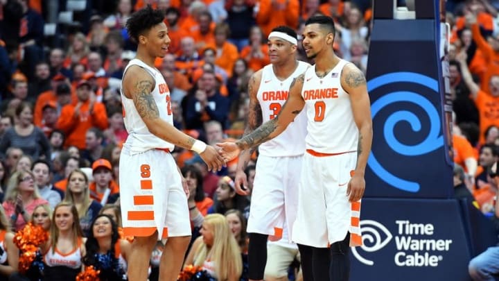 Feb 27, 2016; Syracuse, NY, USA; Syracuse Orange guard Malachi Richardson (23) greets forward Michael Gbinije (0) during a stop in play against the North Carolina State Wolfpack during the second half at the Carrier Dome. Syracuse defeated North Carolina State 75-66. Mandatory Credit: Rich Barnes-USA TODAY Sports