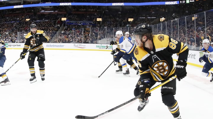 BOSTON, MA - OCTOBER 26: Boston Bruins right wing David Pastrnak (88) holds the puck during a game between the Boston Bruins and the St. Louis Blues on October 26, 2019, at TD Garden in Boston, Massachusetts. (Photo by Fred Kfoury III/Icon Sportswire via Getty Images)