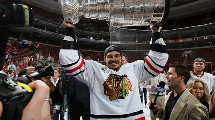 PHILADELPHIA - JUNE 09: Brent Sopel #5 of the Chicago Blackhawks hoists the Stanley Cup after teammate Patrick Kane scored the game-winning goal in overtime to defeat the Philadelphia Flyers 4-3 and win the Stanley Cup in Game Six of the 2010 NHL Stanley Cup Final at the Wachovia Center on June 9, 2010 in Philadelphia, Pennsylvania. (Photo by Jim McIsaac/Getty Images)