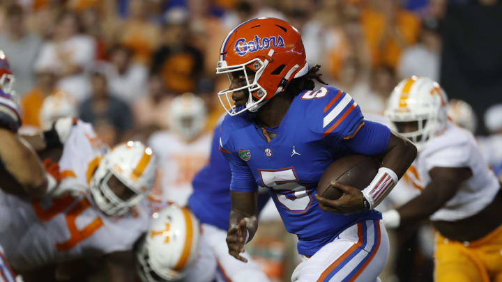 Sep 25, 2021; Gainesville, Florida, USA; Florida Gators quarterback Emory Jones (5) runs with the ball against the Tennessee Volunteers during the first quarter at Ben Hill Griffin Stadium. Mandatory Credit: Kim Klement-USA TODAY Sports