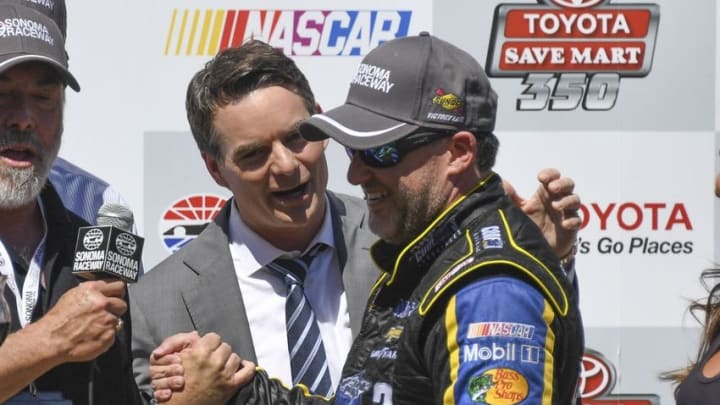 June 26, 2016; Sonoma, CA, USA; Sprint Cup Series driver Tony Stewart (14, right) is congratulated by former driver Jeff Gordon (left) in victory lane during the Toyota Save Mart 350 at Sonoma Raceway. Mandatory Credit: Kyle Terada-USA TODAY Sports