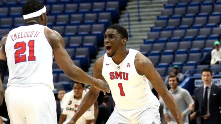 HARTFORD, CT - MARCH 11: Ben Emelogu II #21 of the Southern Methodist Mustangs celebrates with Shake Milton #1 after hitting a three point shot during the championship game of the AAC Basketball Tournament against the Cincinnati Bearcats at the XL Center on March 11, 2017 in Hartford, Connecticut. (Photo by Maddie Meyer/Getty Images)