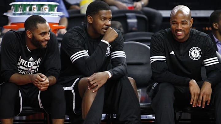 Oct 8, 2015; Auburn Hills, MI, USA; Brooklyn Nets guard Wayne Ellington (L), forward Joe Johnson (C), and guard Jarrett Jack (R) sit on the bench during the second quarter against the Detroit Pistons at The Palace of Auburn Hills. The Nets won 93-83. Mandatory Credit: Raj Mehta-USA TODAY Sports