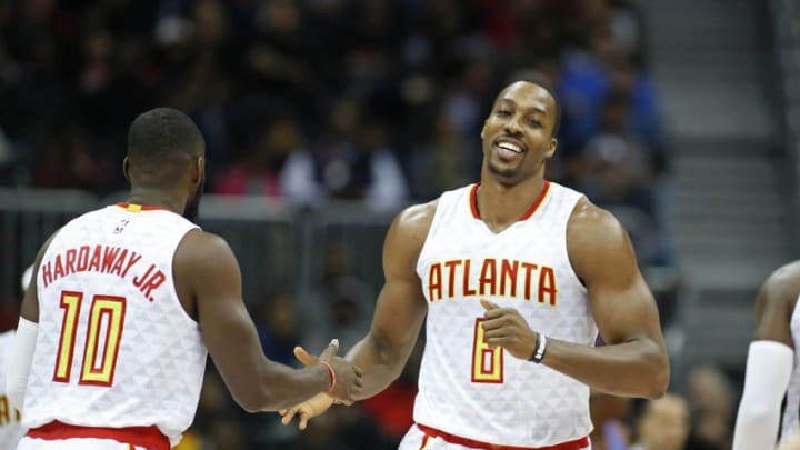 Dec 5, 2016; Atlanta, GA, USA; Atlanta Hawks center Dwight Howard (8) reacts to a play with guard Tim Hardaway Jr. (10) in the first quarter against the Oklahoma City Thunder at Philips Arena. Mandatory Credit: Jason Getz-USA TODAY Sports