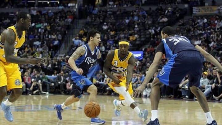 Mar 5, 2014; Denver, CO, USA; Denver Nuggets point guard Ty Lawson (3) passes the ball to power forward J.J. Hickson (7) against Dallas Mavericks power forward Brandan Wright (34) and point guard Shane Larkin (3) in the second quarter at the Pepsi Center. Mandatory Credit: Isaiah J. Downing-USA TODAY Sports
