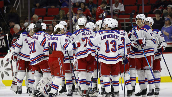 RALEIGH, NORTH CAROLINA - FEBRUARY 11: The New York Rangers celebrate their 6-2 victory over the Carolina Hurricanes following the game at PNC Arena on February 11, 2023, in Raleigh, North Carolina. (Photo by Jared C. Tilton/Getty Images)
