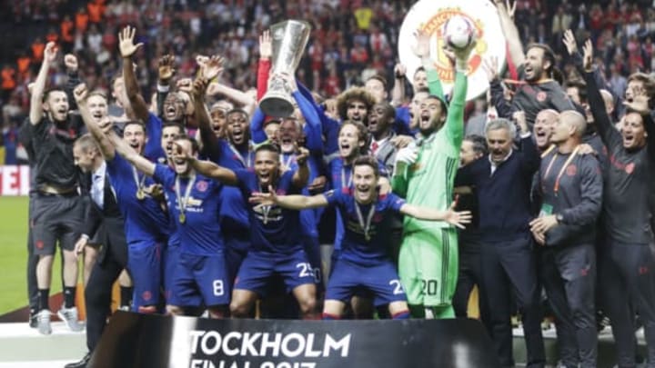 Manchester United players celebrate Europa League victory