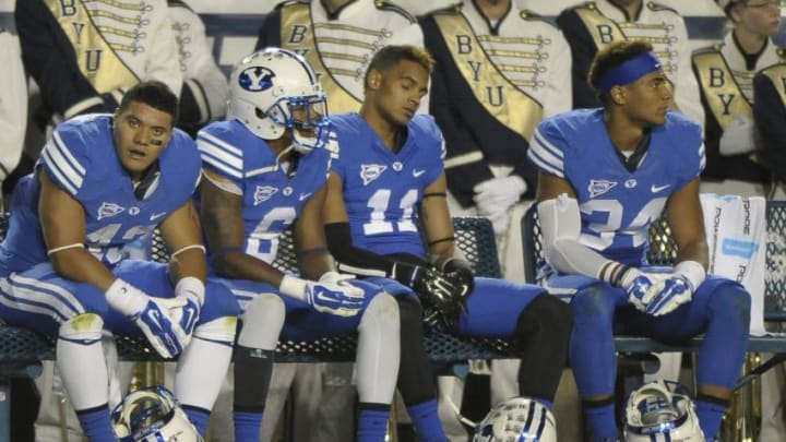 PROVO, UT - OCTOBER 3: Brigham Young Cougar players sit on the bench at the start of the fourth quarter against the Utah State Aggies at LaVell Edwards Stadium on October 3, 2014 in Provo, Utah. (Photo by Gene Sweeney Jr/Getty Images )