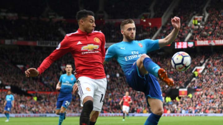 MANCHESTER, ENGLAND – APRIL 29: Calum Chambers of Arsenal is challenged by Jesse Lingard of Manchester United during the Premier League match between Manchester United and Arsenal at Old Trafford on April 29, 2018 in Manchester, England. Arsenal player ratings vs Manchester United. (Photo by Shaun Botterill/Getty Images)