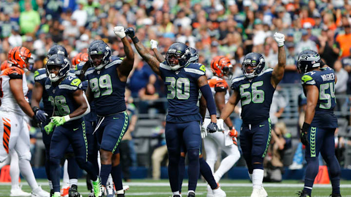 SEATTLE, WA - SEPTEMBER 08: The Seahawks defense, including Quinton Jefferson #99, Bradley McDougald #30 and Mychal Kendricks #56 celebrate a stop against the Cincinnati Bengals in the second quarter at CenturyLink Field on September 8, 2019 in Seattle, Washington. (Photo by Lindsey Wasson/Getty Images)