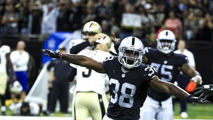 Sep 11, 2016; New Orleans, LA, USA; Oakland Raiders strong safety T.J. Carrie (38) celebrates after New Orleans Saints kicker Will Lutz (3) misses a 61 yard field goal attempt as time expires during the fourth quarter of a game at the Mercedes-Benz Superdome. The Raiders defeated the Saints 35-34. Mandatory Credit: Derick E. Hingle-USA TODAY Sports