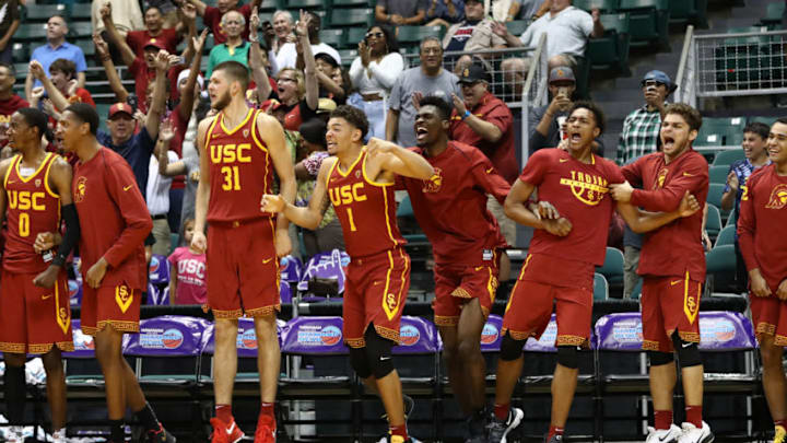 HONOLULU, HI - DECEMBER 25: The USC Trojan bench celebrates after Bennie Boatwright #25 hit a three point shot during the final seconds of the championship game against the New Mexico State Aggies of the Diamond Head Classic at the Stan Sheriff Center on December 25, 2017 in Honolulu, Hawaii. (Photo by Darryl Oumi/Getty Images)