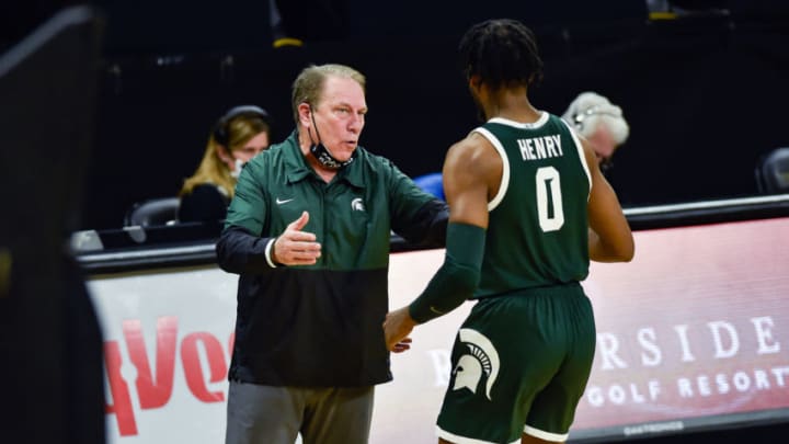 Feb 2, 2021; Iowa City, Iowa, USA; Michigan State Spartans head coach Tom Izzo (L) talks to forward Aaron Henry (0) during the first half against the Iowa Hawkeyes at Carver-Hawkeye Arena. Mandatory Credit: Jeffrey Becker-USA TODAY Sports