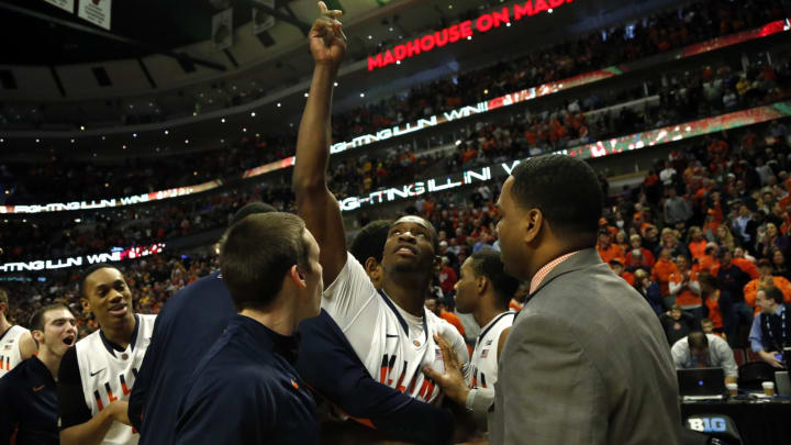 Brandon Paul (3) of Illinois celebrates with teammates after hitting the game-winning shot against Minnesota in their first-round game in the Big Ten Tournament on Thursday, March 14, 2013, in Chicago, Illinois. (Jose M. Osorio/Chicago Tribune/Tribune News Service via Getty Images)
