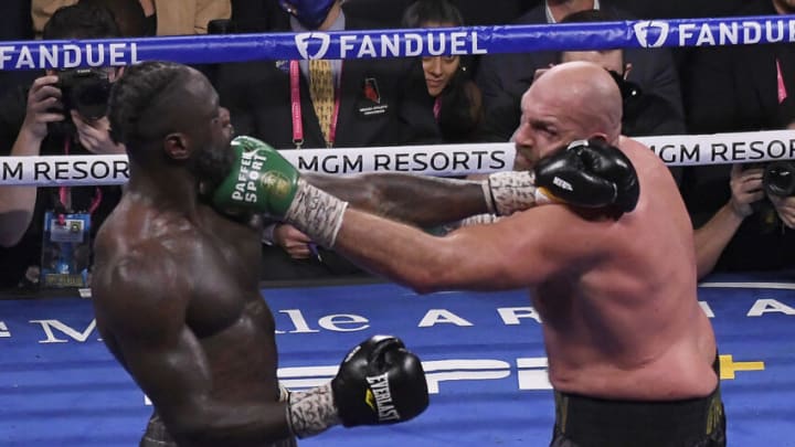 LAS VEGAS, NV - OCTOBER 09: ( In Black trunks) Tyson Fury punches Deontay Wilder during the World Heavyweight Championship III trilogy fight at T-Mobile Arena Saturday October 9, 2021. Tyson Fury took the win by KO Deontay Wilder in the 11th round in Las Vegas, Nevada.(Photo by MB Media/Getty Images)