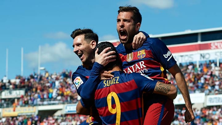 GRANADA, SPAIN - MAY 14: Luis Suarez of FC Barcelona celebrates scoring his team's first goal with his teamates Lionel Messi and Jordi Alba during the La Liga match between Granada CF and FC Barcelona at Estadio Nuevo Los Carmenes on May 14, 2016 in Granada, Spain. (Photo by Manuel Queimadelos Alonso/Getty Images)