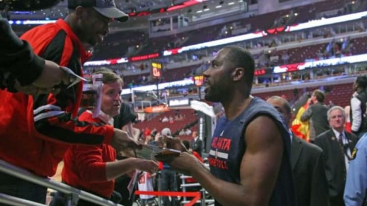 Apr 15, 2015; Chicago, IL, USA; Atlanta Hawks forward Elton Brand (7) sings an autograph before playing against the Chicago Bulls at the United Center. Mandatory Credit: Dennis Wierzbicki-USA TODAY Sports