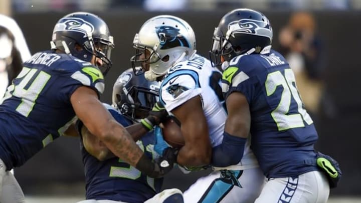 Jan 17, 2016; Charlotte, NC, USA; Carolina Panthers wide receiver Jerricho Cotchery (82) is taken down by Seattle Seahawks defense during the third quarter in a NFC Divisional round playoff game at Bank of America Stadium. Mandatory Credit: John David Mercer-USA TODAY Sports