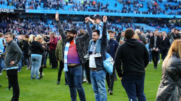 MANCHESTER, ENGLAND - APRIL 22: Fans invade the pitch following the Premier League match between Manchester City and Swansea City at Etihad Stadium on April 22, 2018 in Manchester, England. (Photo by Clive Brunskill/Getty Images)