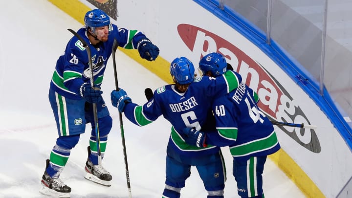 The Vancouver Canucks celebrate a second-period goal by Elias Pettersson #40 (Photo by Jeff Vinnick/Getty Images)