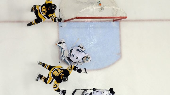 Jun 1, 2016; Pittsburgh, PA, USA; Pittsburgh Penguins center Sidney Crosby (87) and right wing Patric Hornqvist (72) celebrate after a game-winning goal by left wing Conor Sheary (not pictured) past San Jose Sharks goalie Martin Jones in overtime in game two of the 2016 Stanley Cup Final at Consol Energy Center. Mandatory Credit: Don Wright-USA TODAY Sports
