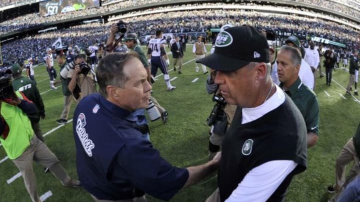 Oct 20, 2013; East Rutherford, NJ, USA; New York Jets head coach Rex Ryan (right) and New England Patriots head coach Bill Belichick shake hands after the game at MetLife Stadium. The Jets won the game 30-27 in overtime. Mandatory Credit: Joe Camporeale-USA TODAY Sports