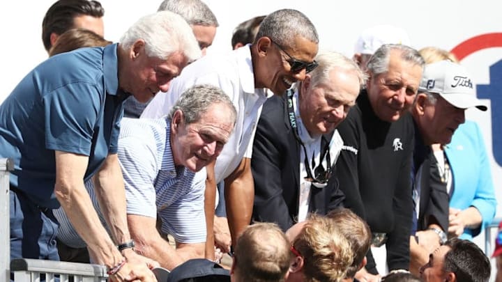 JERSEY CITY, NJ - SEPTEMBER 28: (L-R) Former U.S. Presidents Bill Clinton, George W. Bush, Barack Obama, and Jack Nicklaus and Gary Player greet members of the U.S. Team on the first tee during Thursday foursome matches of the Presidents Cup at Liberty National Golf Club on September 28, 2017 in Jersey City, New Jersey. (Photo by Elsa/Getty Images) JERSEY CITY, NJ - SEPTEMBER 28: (L-R) Former U.S. Presidents Bill Clinton, George W. Bush, Barack Obama, and Jack Nicklaus and Gary Player greet members of the U.S. Team on the first tee during Thursday foursome matches of the Presidents Cup at Liberty National Golf Club on September 28, 2017 in Jersey City, New Jersey. (Photo by Elsa/Getty Images)