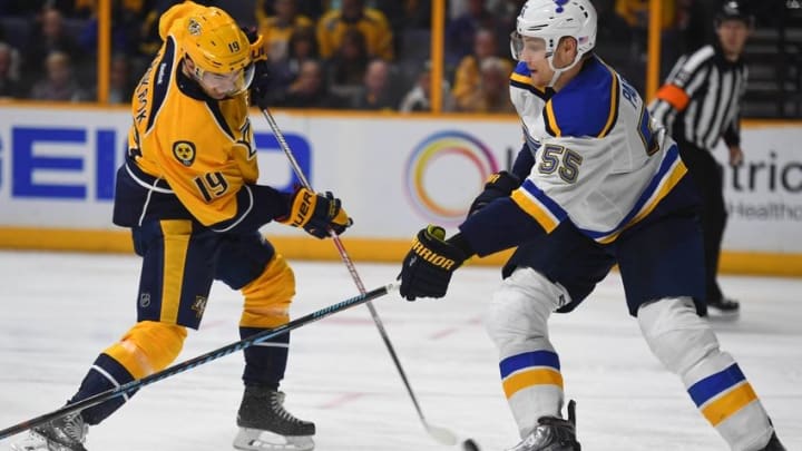 Nov 10, 2016; Nashville, TN, USA; Nashville Predators center Calle Jarnkrok (19) scores a goal during the third period while he is defended by St. Louis Blues defenseman Colton Parayko (55) at Bridgestone Arena. Mandatory Credit: Christopher Hanewinckel-USA TODAY Sports