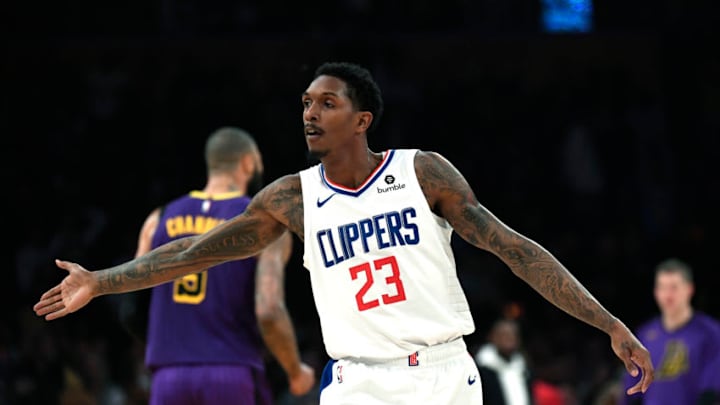 LOS ANGELES, CA - DECEMBER 28: Lou Williams #23 of the Los Angeles Clippers celebrates after scoring a three point basket to beat the halftime buzzer against against Los Angeles Lakers at Staples Center on December 28, 2018 in Los Angeles, California. NOTE TO USER: User expressly acknowledges and agrees that, by downloading and or using this photograph, User is consenting to the terms and conditions of the Getty Images License Agreement. (Photo by Kevork Djansezian/Getty Images)