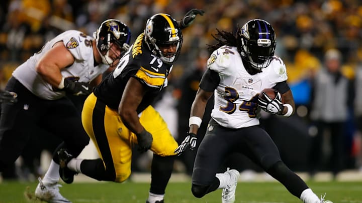 PITTSBURGH, PA – DECEMBER 10: Alex Collins #34 of the Baltimore Ravens carries the ball against Javon Hargrave #79 of the Pittsburgh Steelers in the third quarter during the game at Heinz Field on December 10, 2017 in Pittsburgh, Pennsylvania. (Photo by Justin K. Aller/Getty Images)